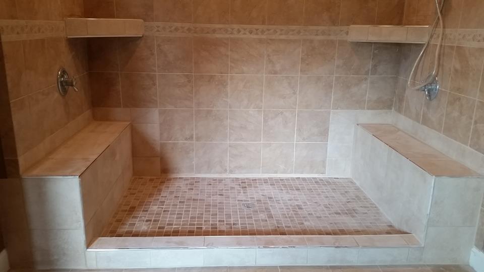 Mirrored shower benches which were added years after the initial shower was installed. the lighter color tile was selected to contrast the original tile since we were unable to find the original wall tile In the Barboursville, WV; Milton, WV; Hurricane, WV area