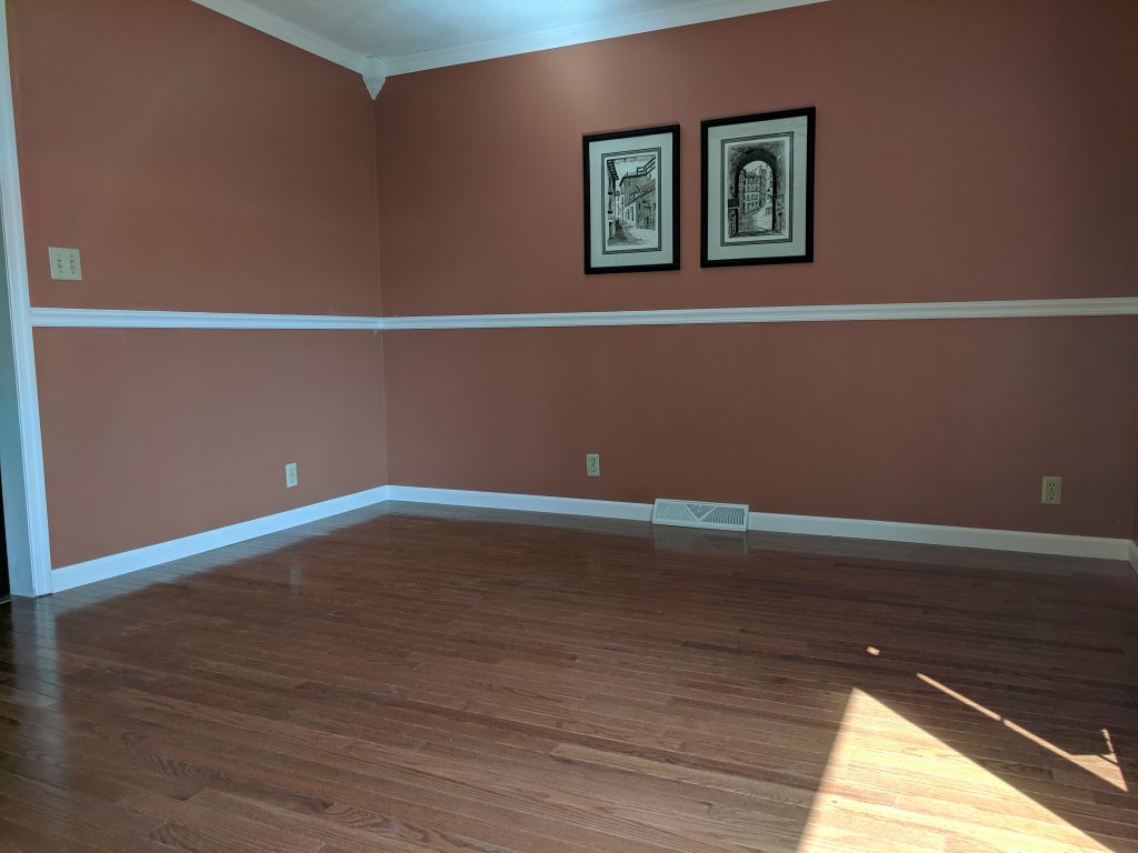 After photo of 3/4 oak flooring replacing carpet, new crown molding with corner blocks, 1 piece chair railing and painted 1 piece base In the Flatwoods, KY; ashland, KY; Catlettsburg, KY area