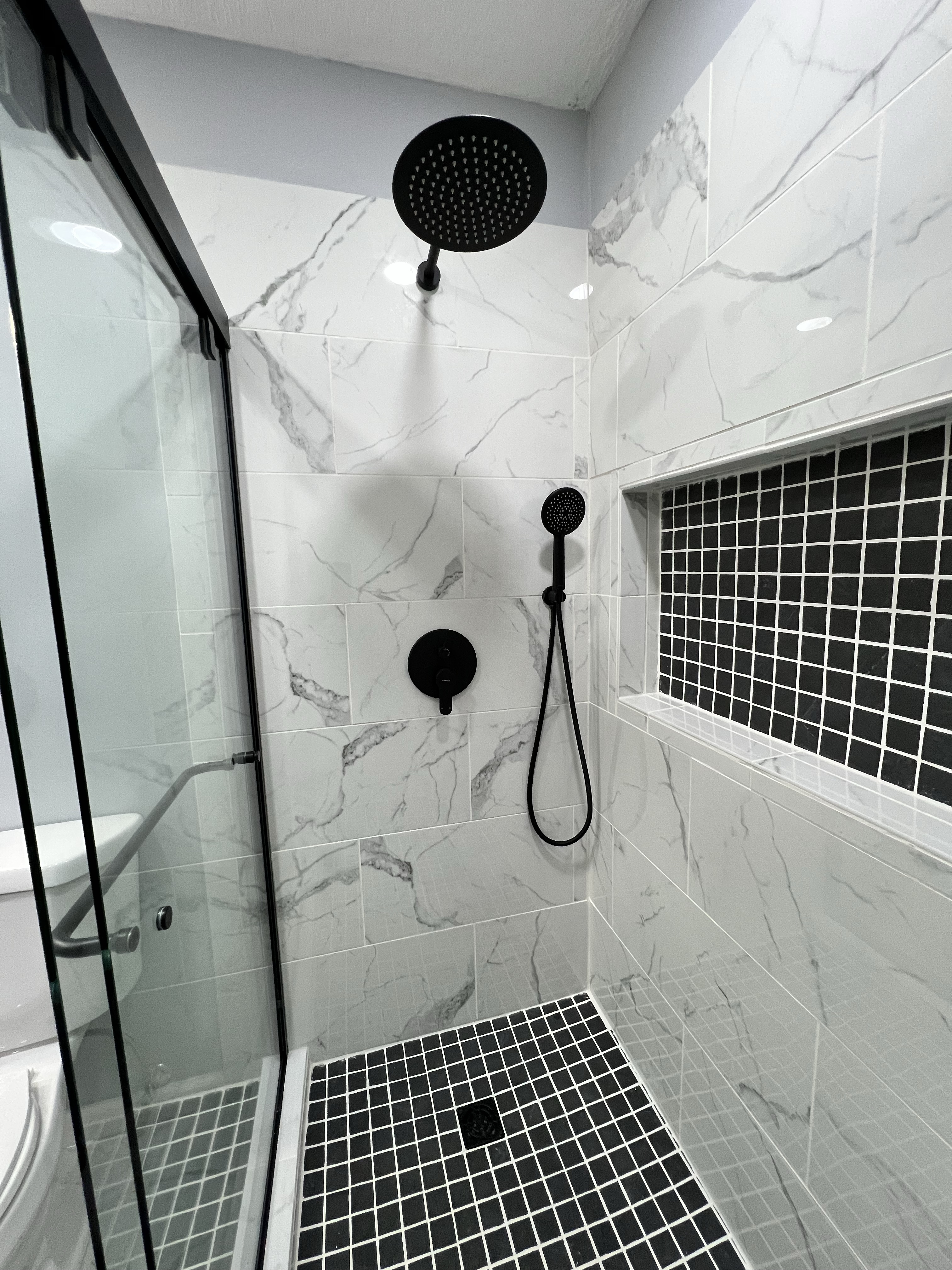 Thompson Parker Builders- Shower with stationary and hand-held shower heads