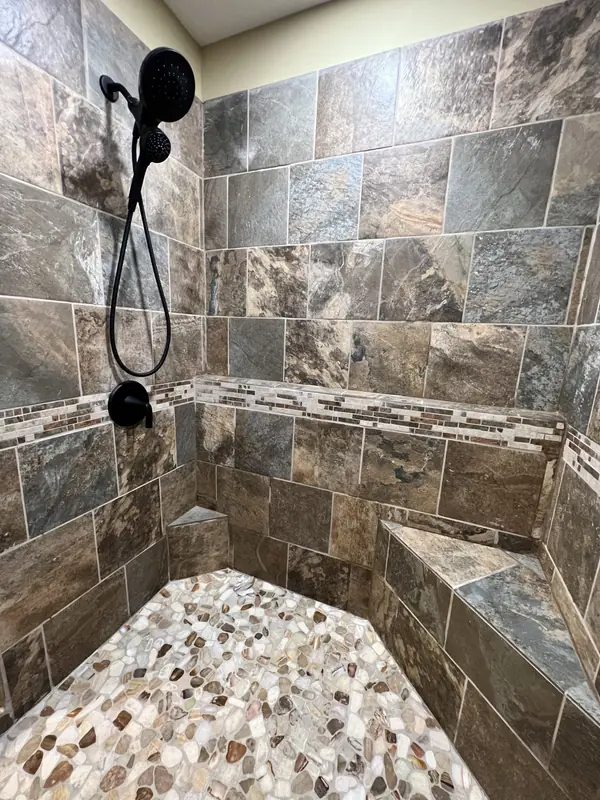 Custom tile shower surround with built-in seat
